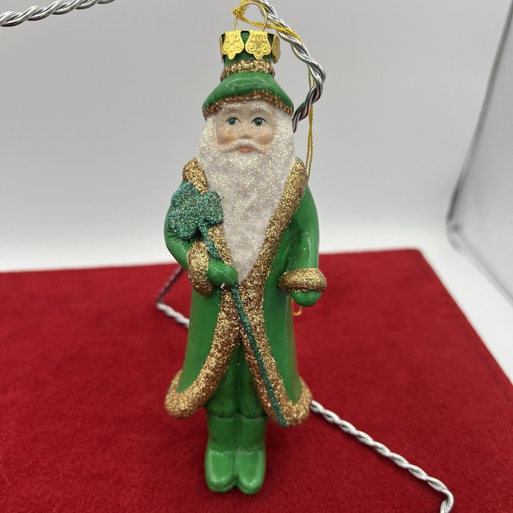 vintage‎ glass Christmas ornament depicting Santa Claus dressed in green
